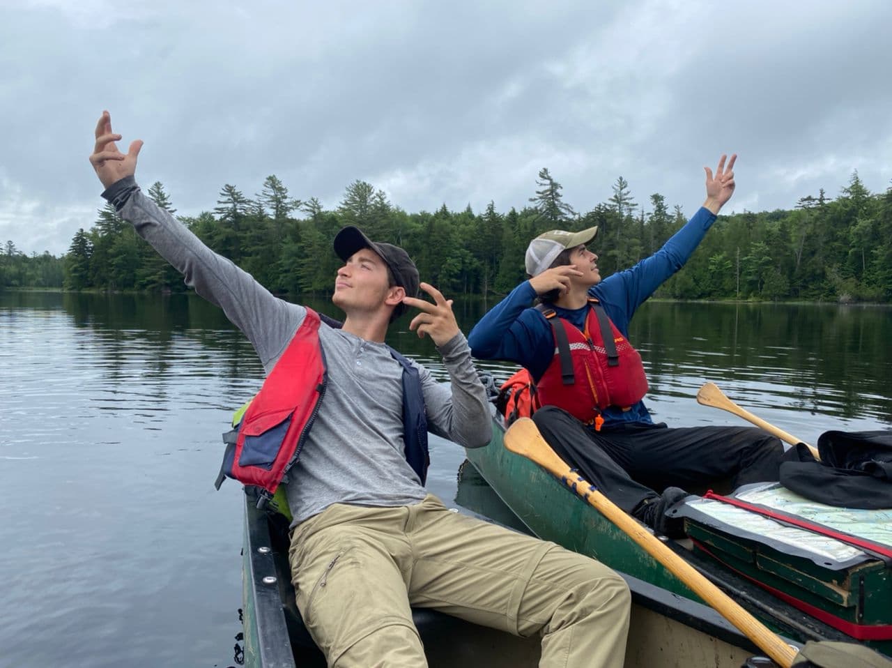 Logan canoeing on a lake